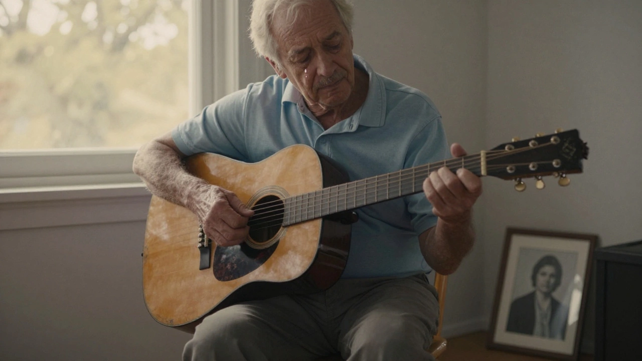 An elderly man playing guitar with a tearful expression, surrounded by quiet light.